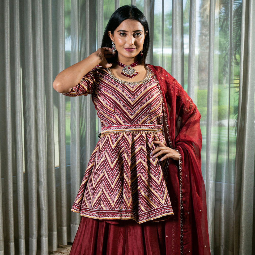 Flared Maroon Silk Lehenga with Intricate Embroidery and Handcrafted Details