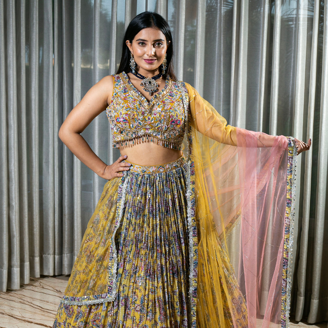 Flared Yellow Lehenga with Intricate Embroidery and Net Dupatta